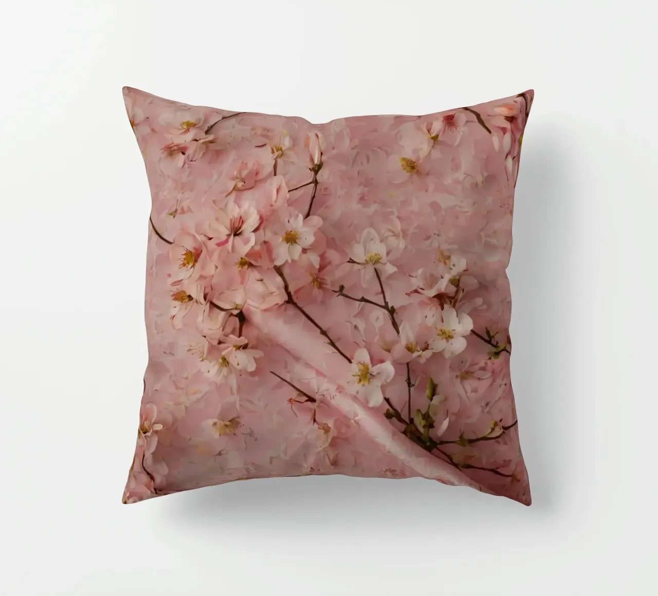 Delicati fiori di ciliegio rosa disposti su un tappeto rosa tenue cuscino da DesignDoodle