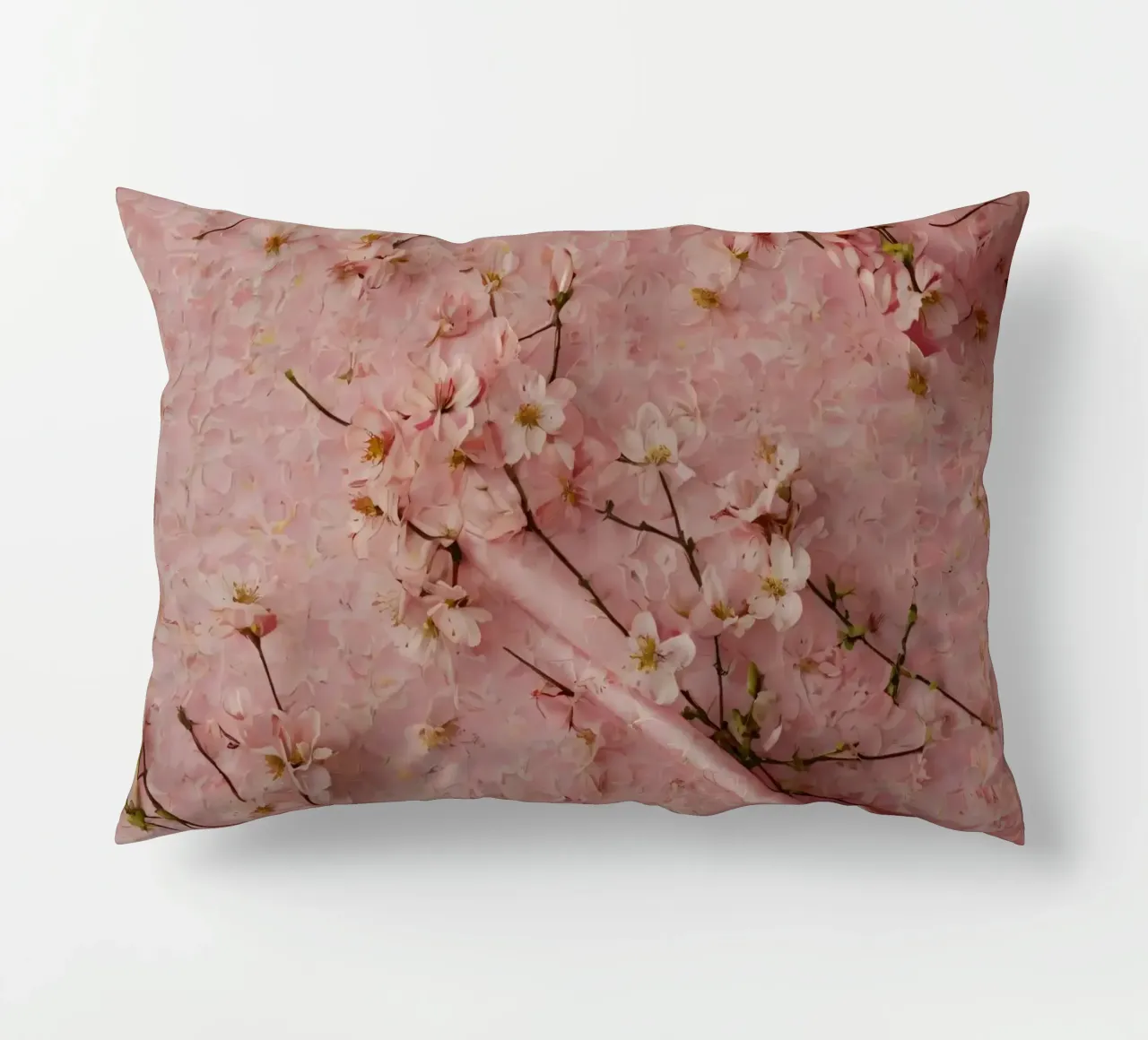 Delicati fiori di ciliegio rosa disposti su un tappeto rosa tenue cuscino da DesignDoodle