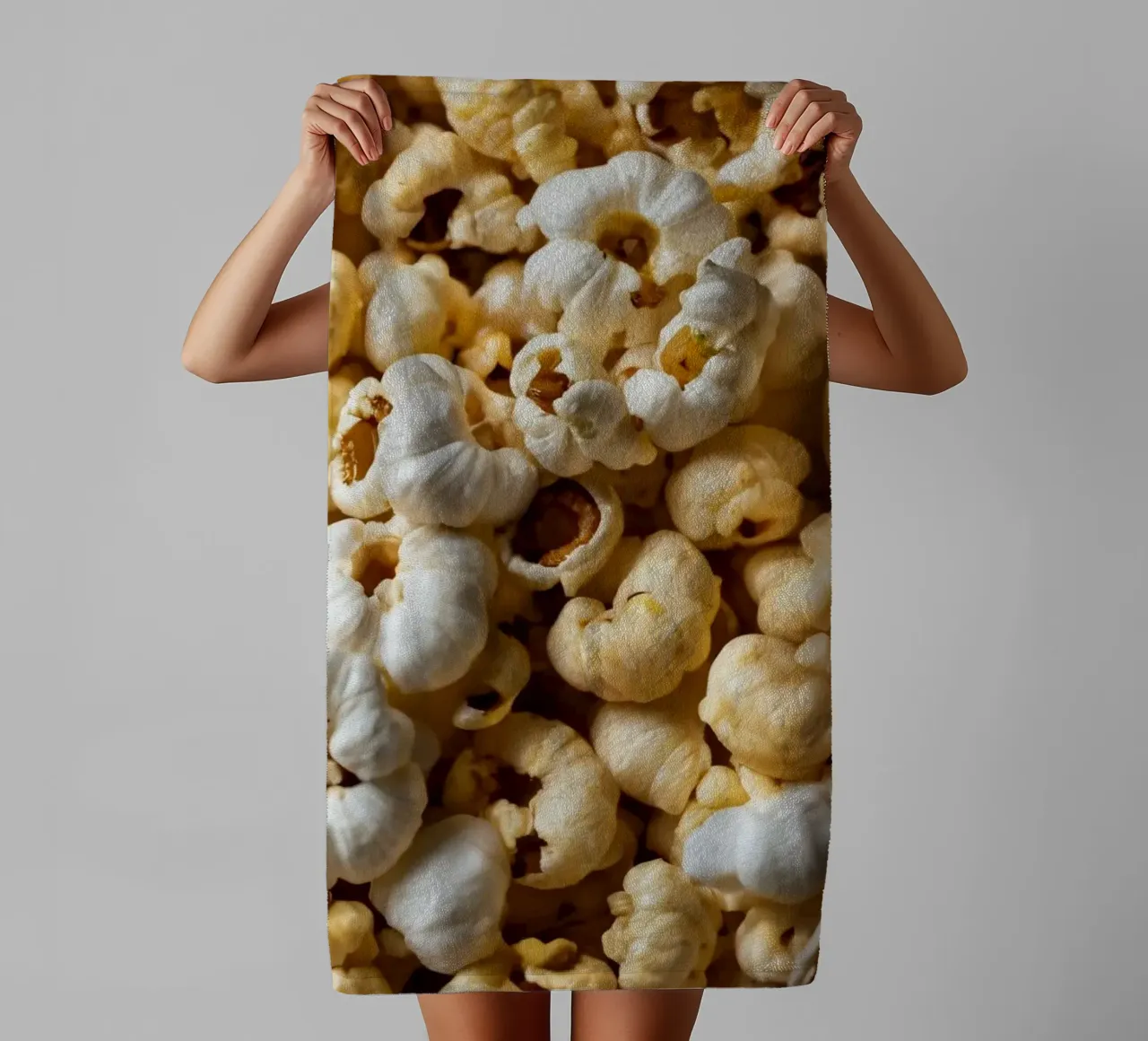 Freshly popped popcorn in a close-up view towel by DesignDoodle