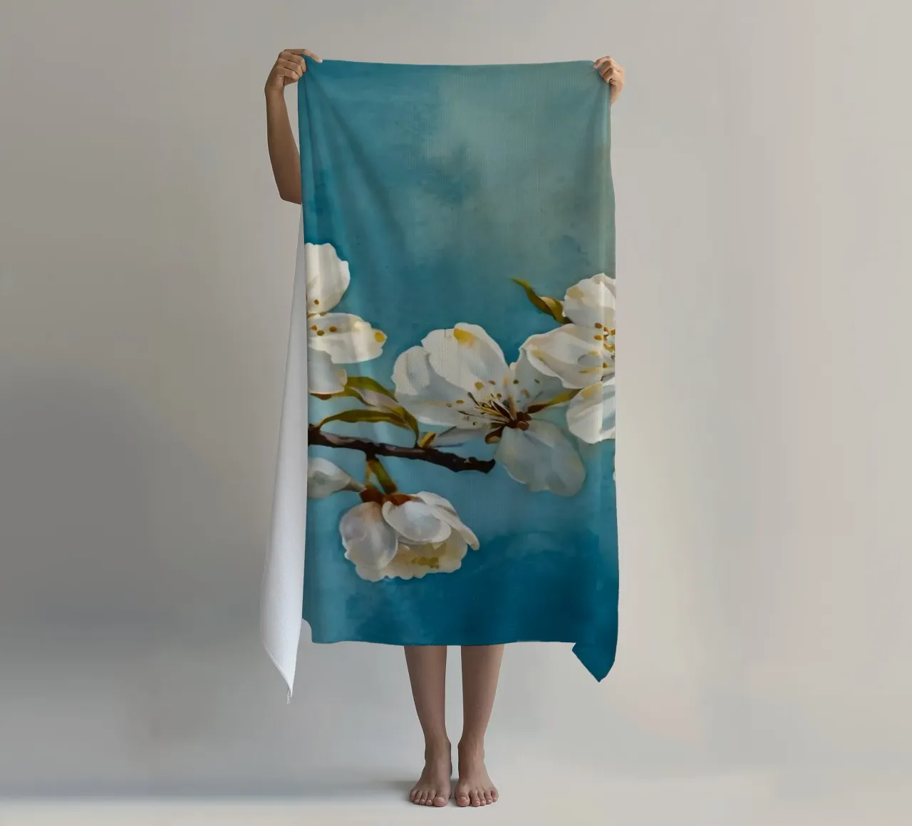 Blossoming cherry tree branch adorned with delicate white beach towel by DesignDoodle