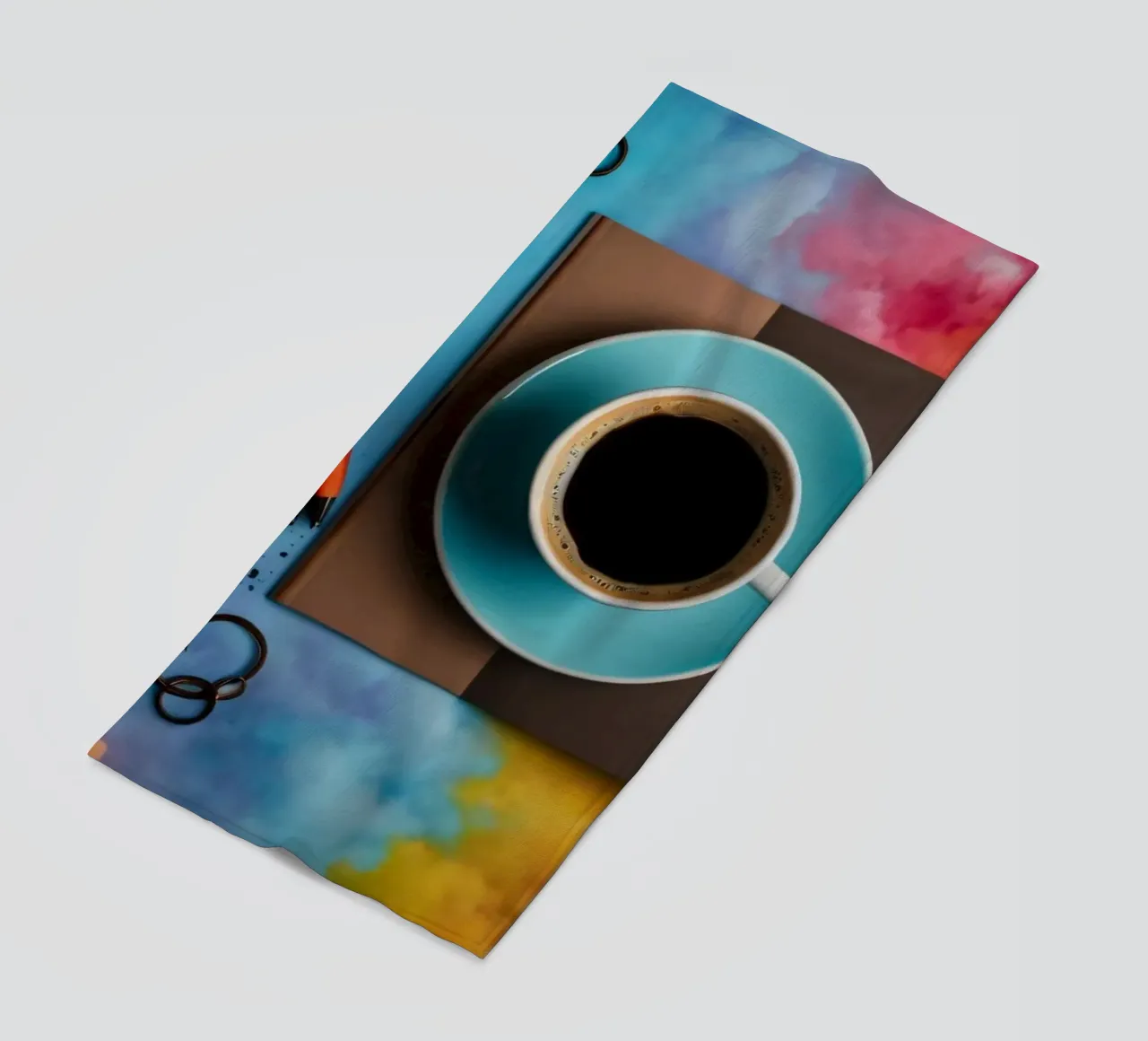 spazio di lavoro caratterizzato da una tazza di caffè blu su un'opera d'arte colorata. telo mare da DesignDoodle