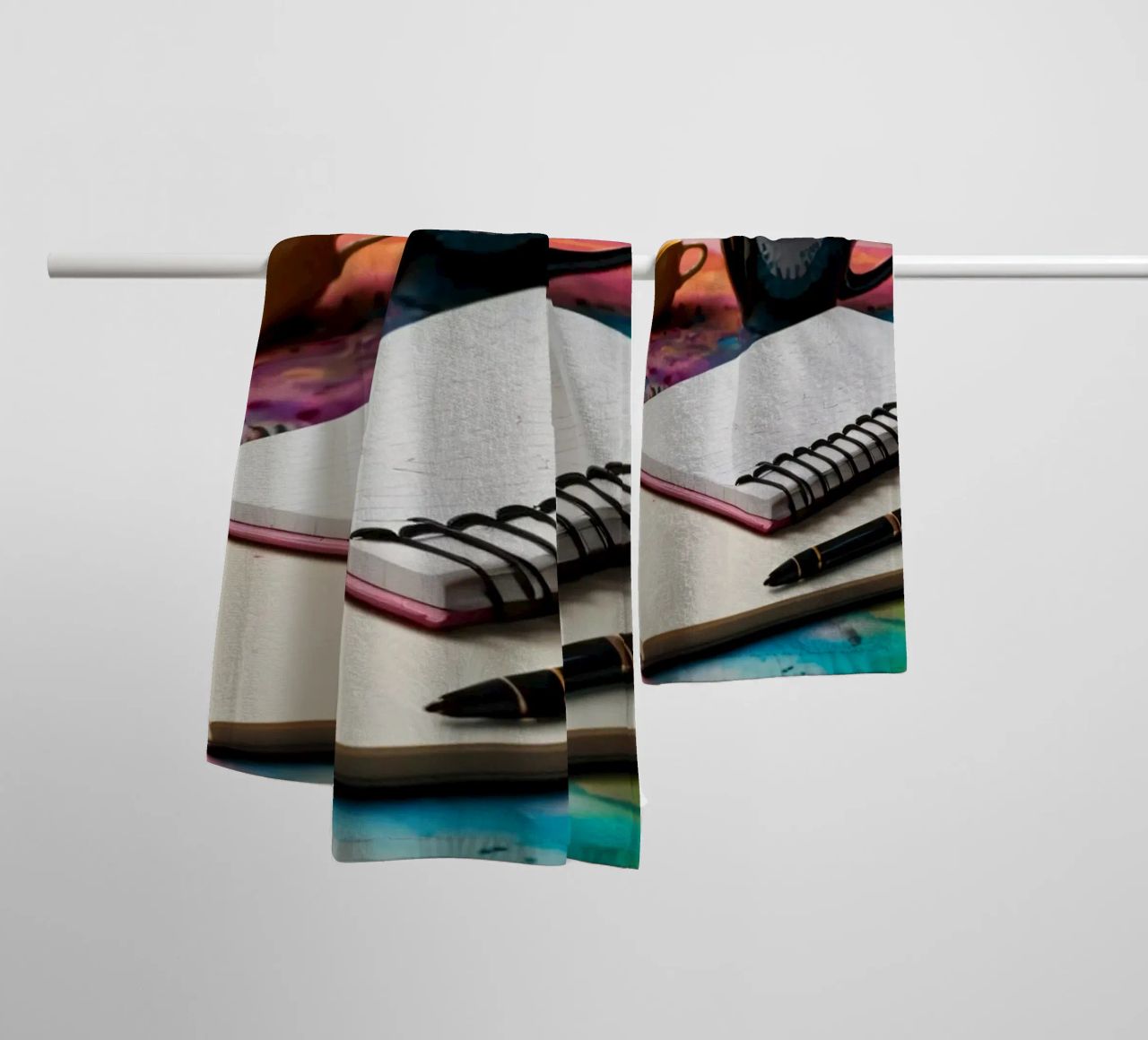 A cozy workspace featuring a steaming cup of coffee towel by DesignDoodle