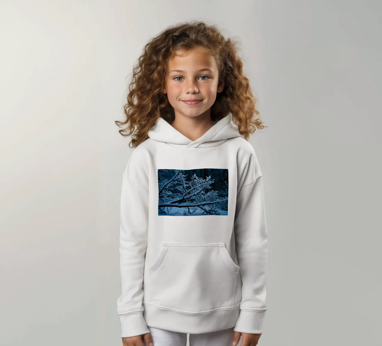 Snow-covered branches create a calm winter landscape kids hoodie by DesignDoodle