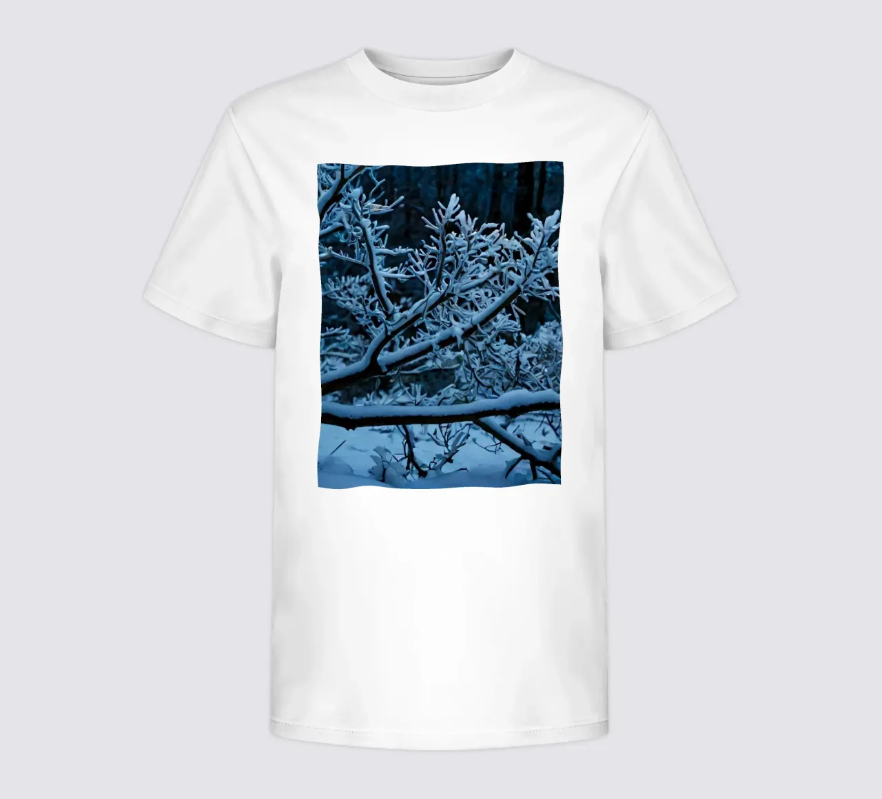 Snow-covered branches create a calm winter landscape kids t-shirt by DesignDoodle