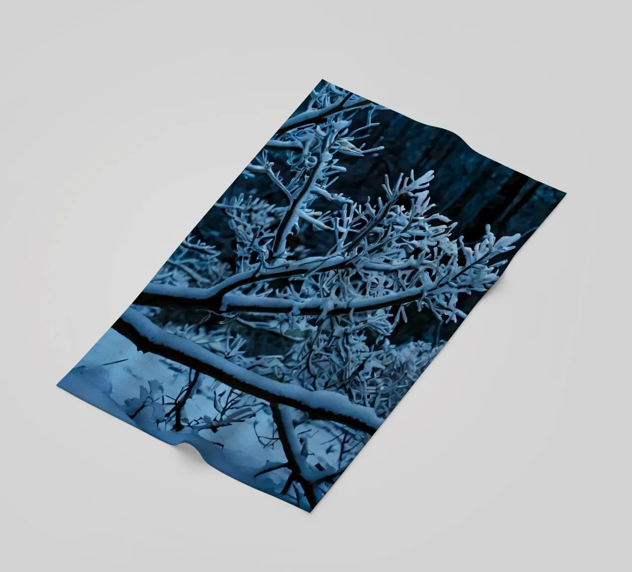 Snow-covered branches create a calm winter landscape beach towel by DesignDoodle