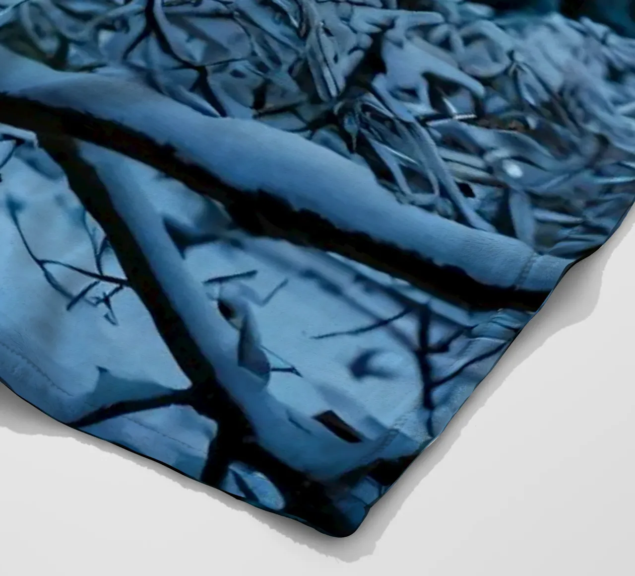 Snow-covered branches create a calm winter landscape fleece blanket by DesignDoodle
