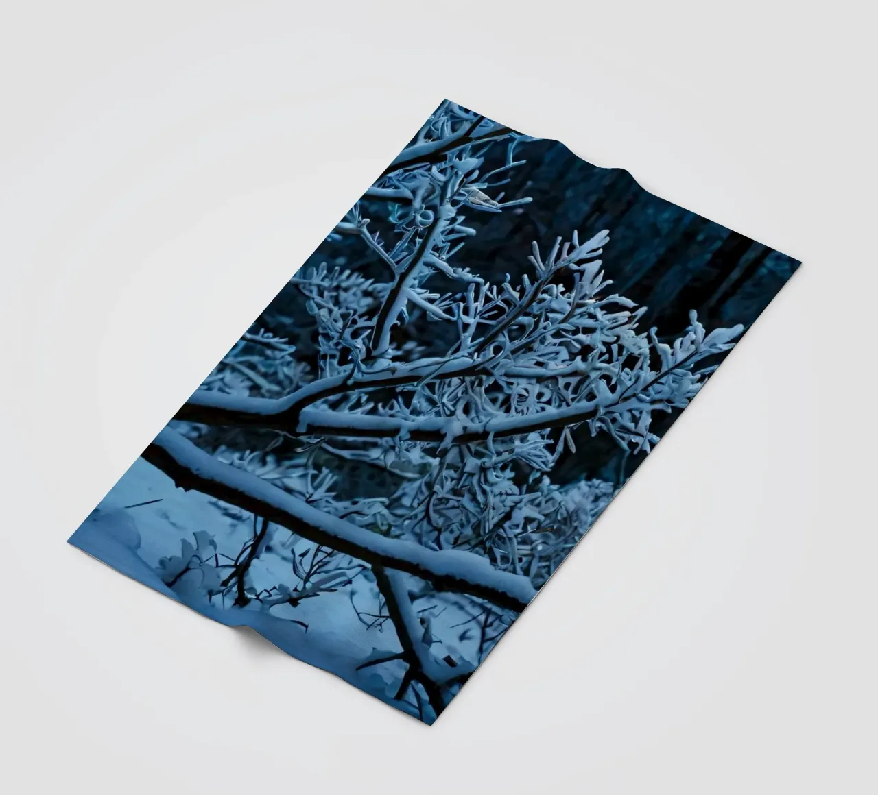 Snow-covered branches create a calm winter landscape fleece blanket by DesignDoodle