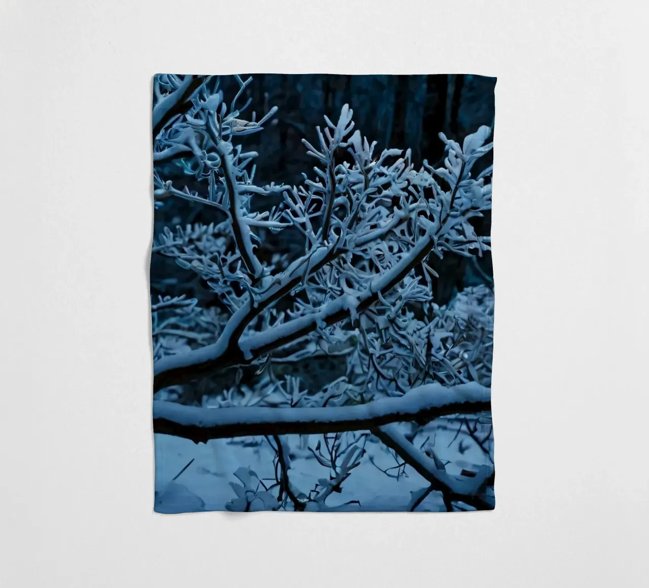 Snow-covered branches create a calm winter landscape fleece blanket by DesignDoodle