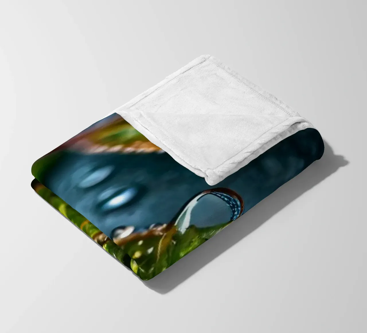 leaves glistening with raindrops after a refreshing rain fleece blanket by DesignDoodle