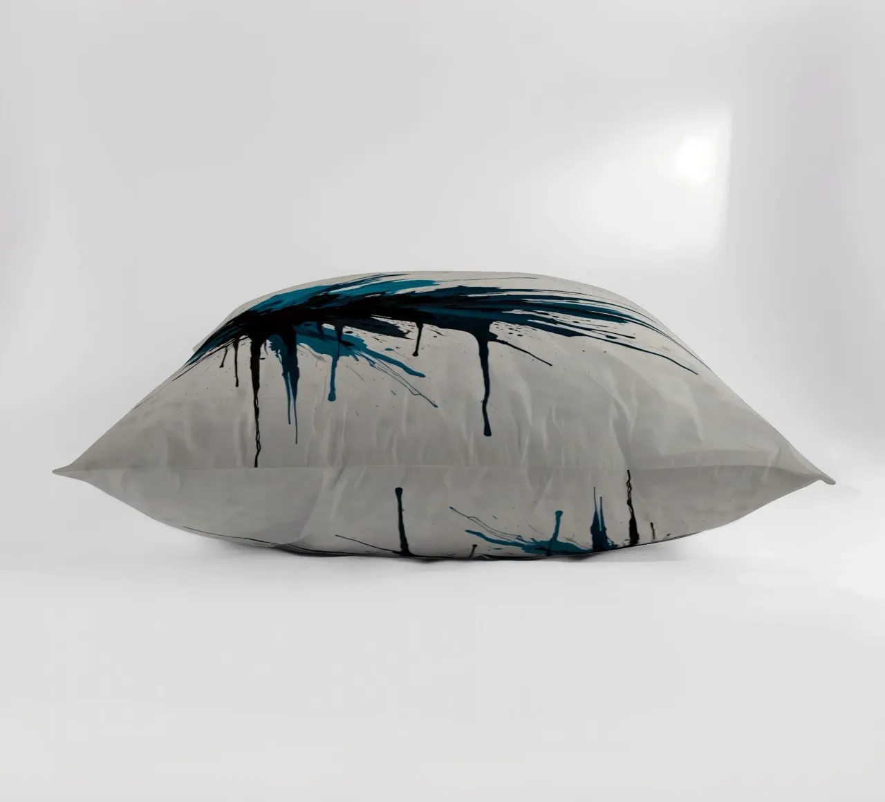 Abstract explosion of teal and black paint on a white canvas decorative cushion by DesignDoodle