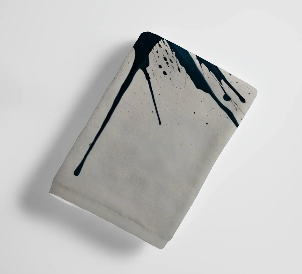 Abstract explosion of teal and black paint on a white canvas towel by DesignDoodle