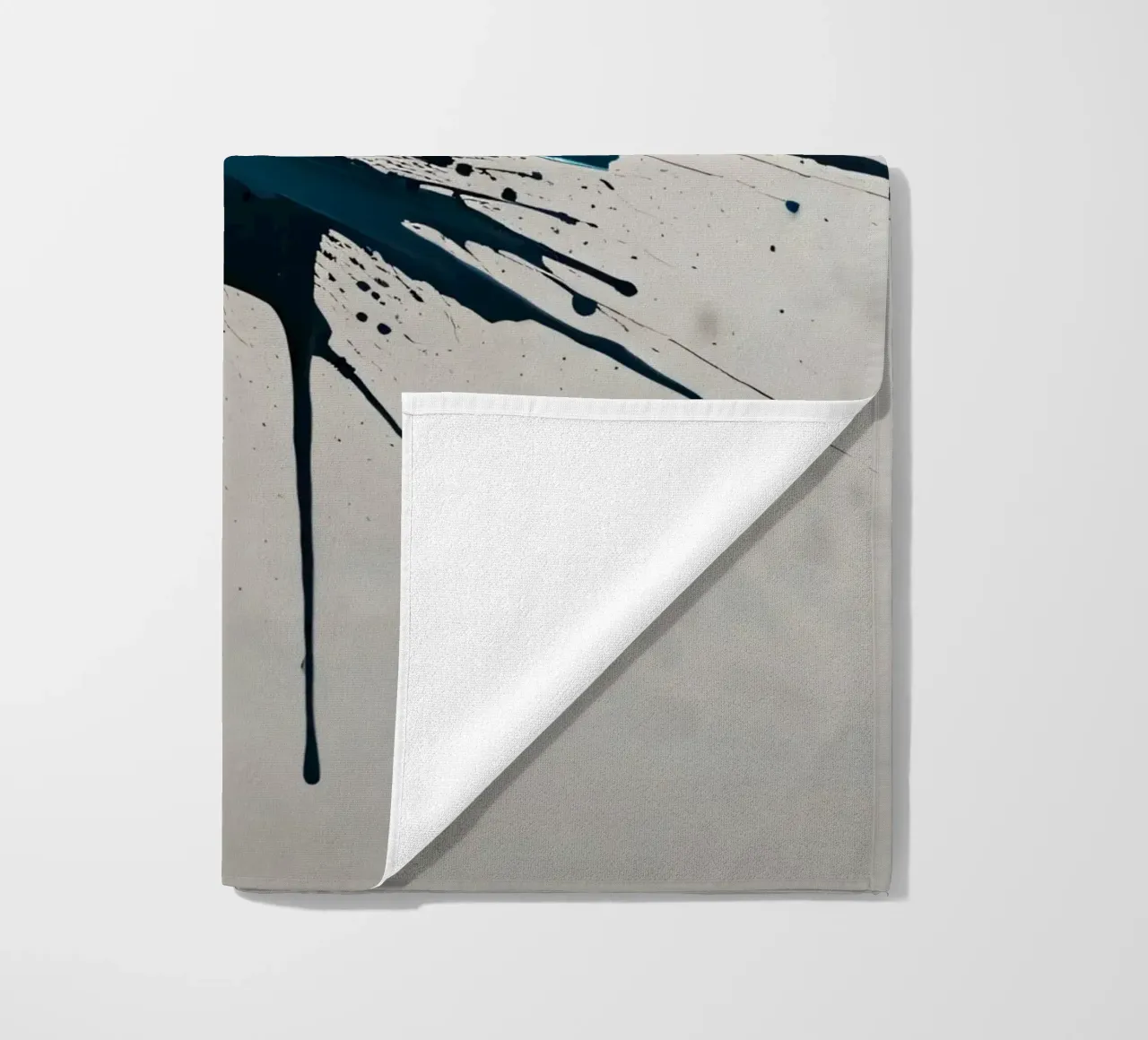 Abstract explosion of teal and black paint on a white canvas beach towel by DesignDoodle