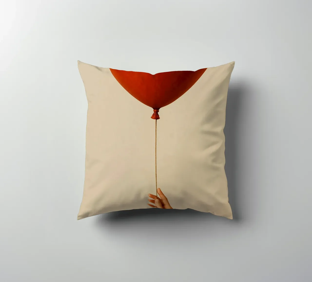 Held by a String: A Terracotta Heart Balloon cuscino da Mosaic Dialogue