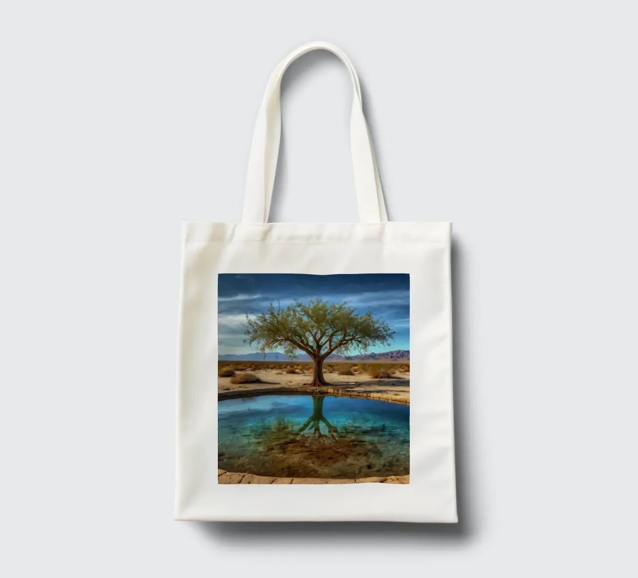 Un'oasi di pace nel deserto con un albero vivace che si riflette in un'atmosfera limpida. borsa in juta da DesignDoodle