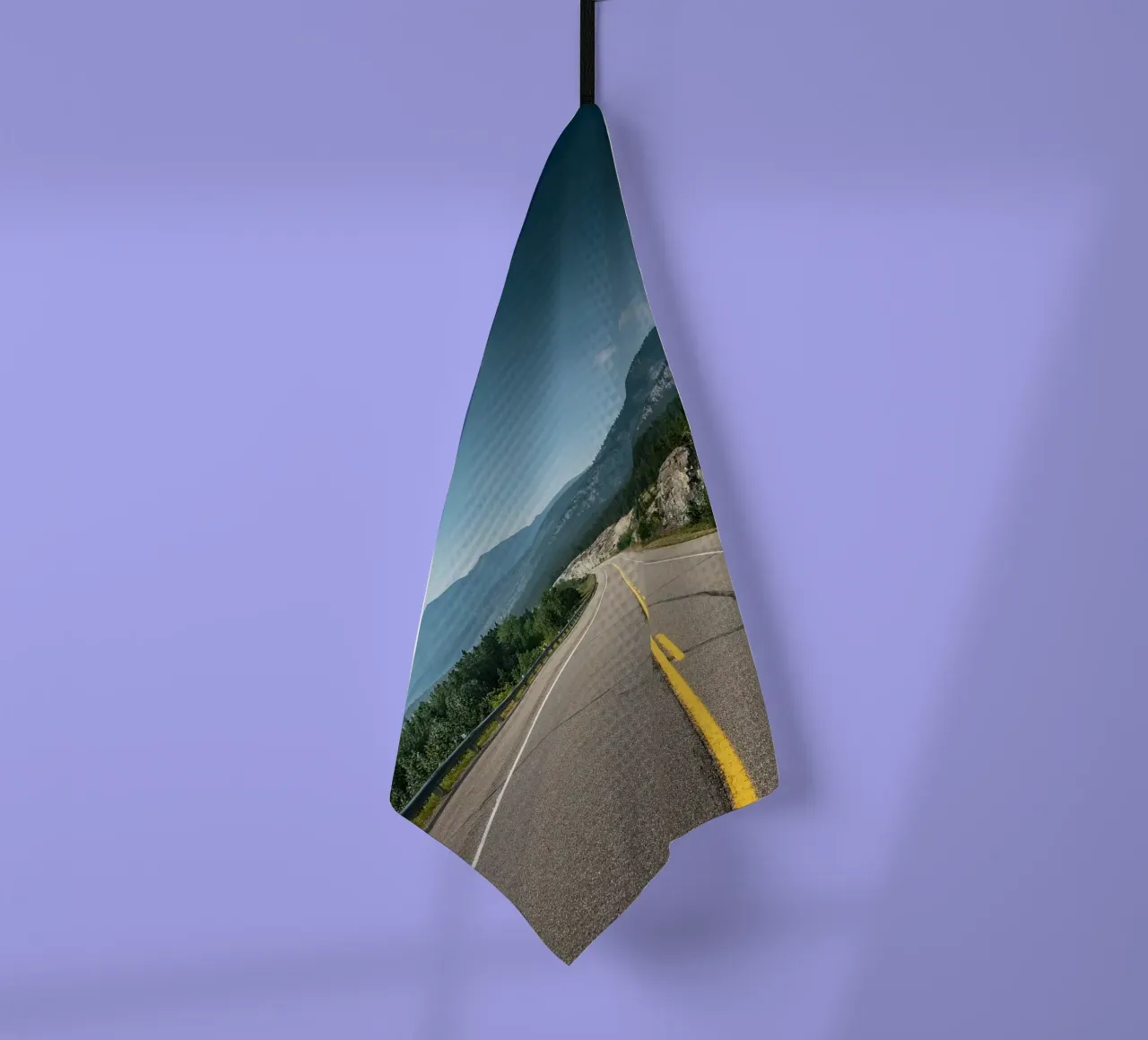 road highway mountains forest trees sky clouds pavement tea towel by minerva santiago