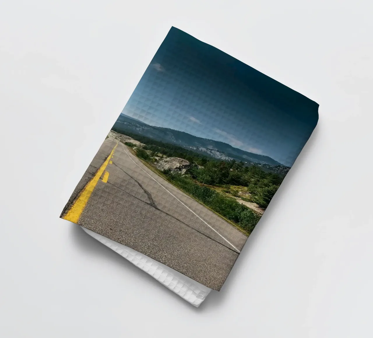 road highway mountains forest trees sky clouds pavement tea towel by minerva santiago