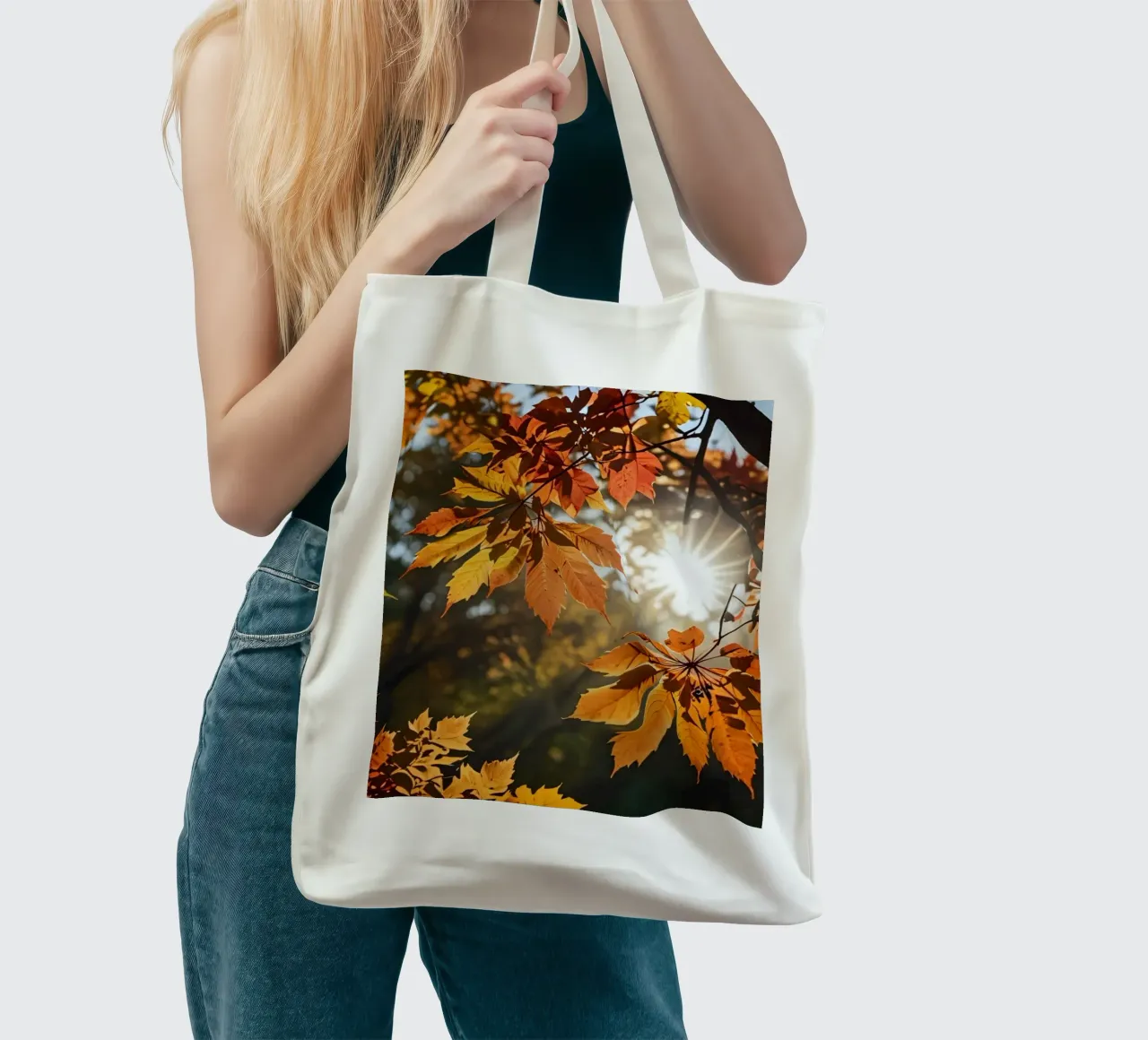 Autumn leaves in vibrant colors illuminated by sunlight tote bag by DesignDoodle
