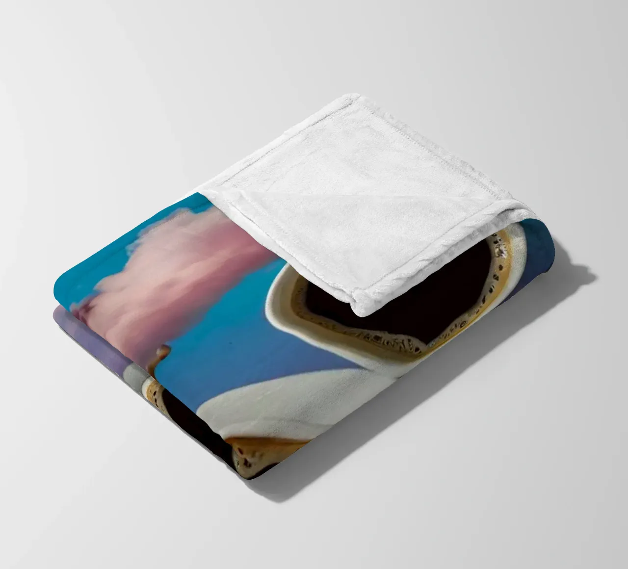 Two steaming cups of coffee resting atop colorful clouds art fleece blanket by DesignDoodle