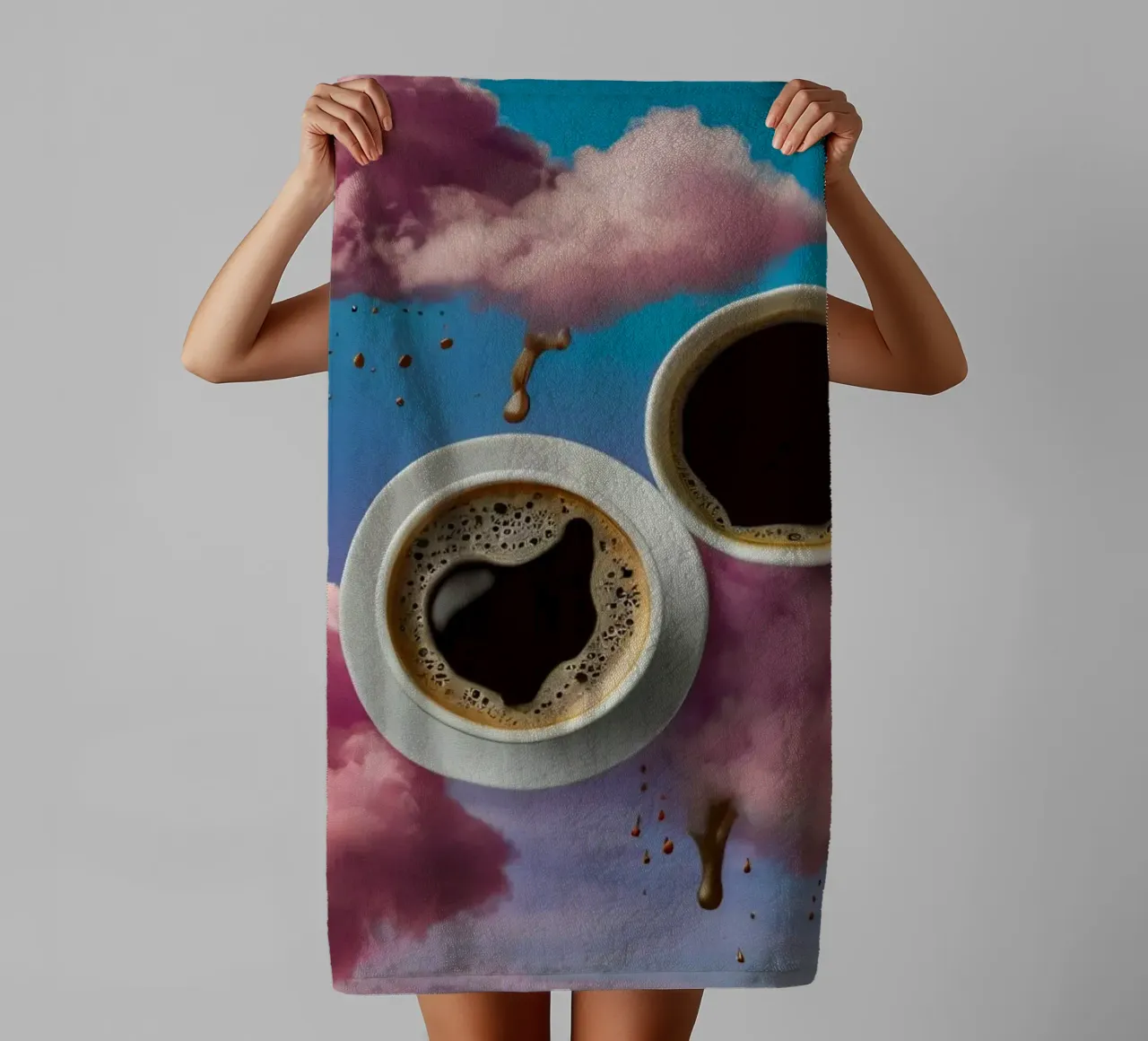 Two steaming cups of coffee resting atop colorful clouds art towel by DesignDoodle