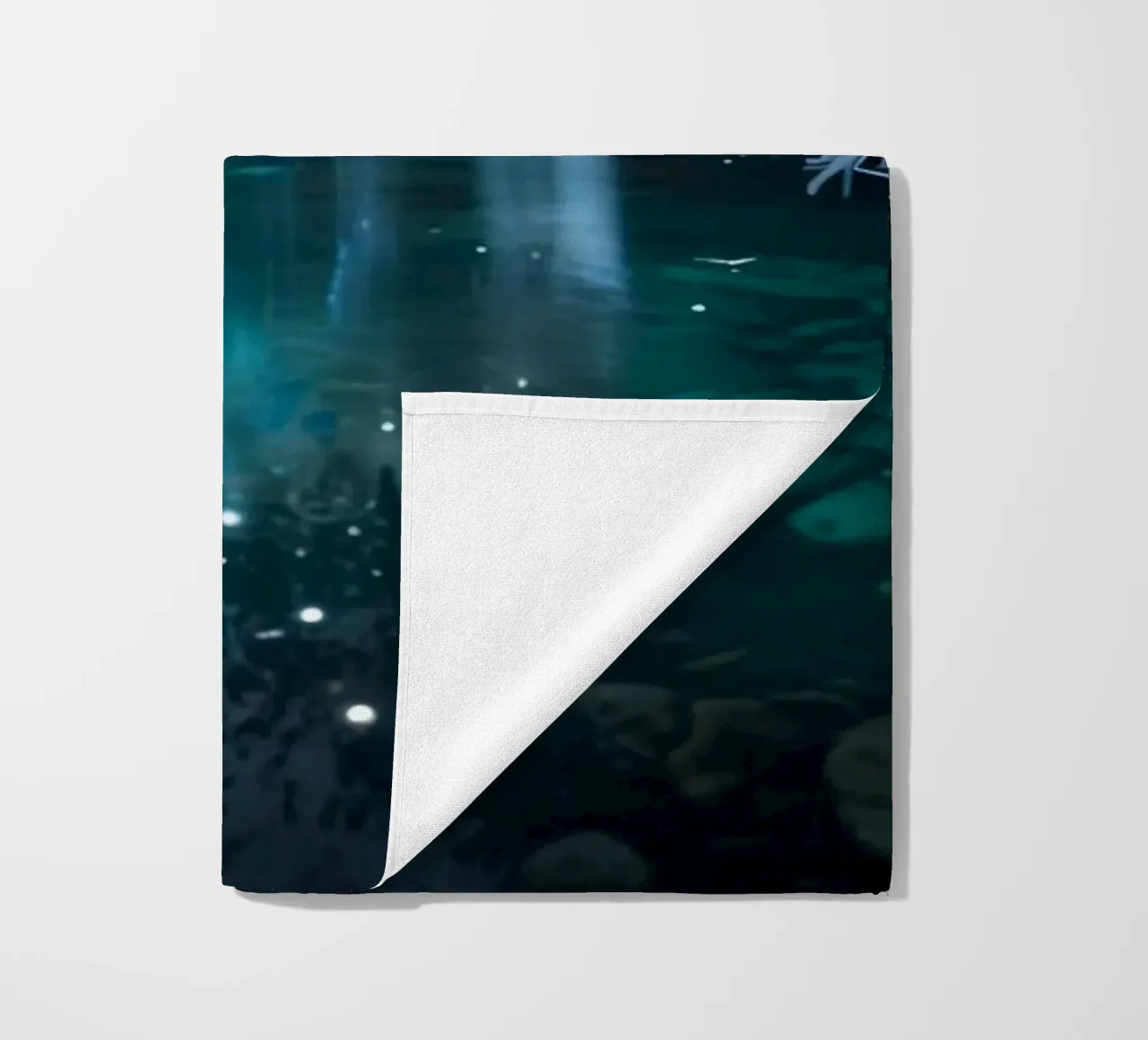 A serene winter waterfall shimmering under the moonlight in beach towel by DesignDoodle