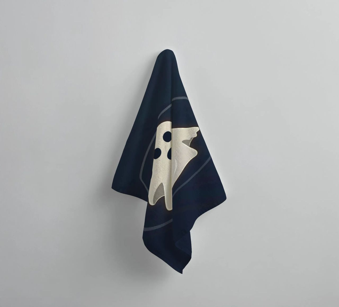 Cartoon ghost with surprised expression on dark background towel by DesignDoodle
