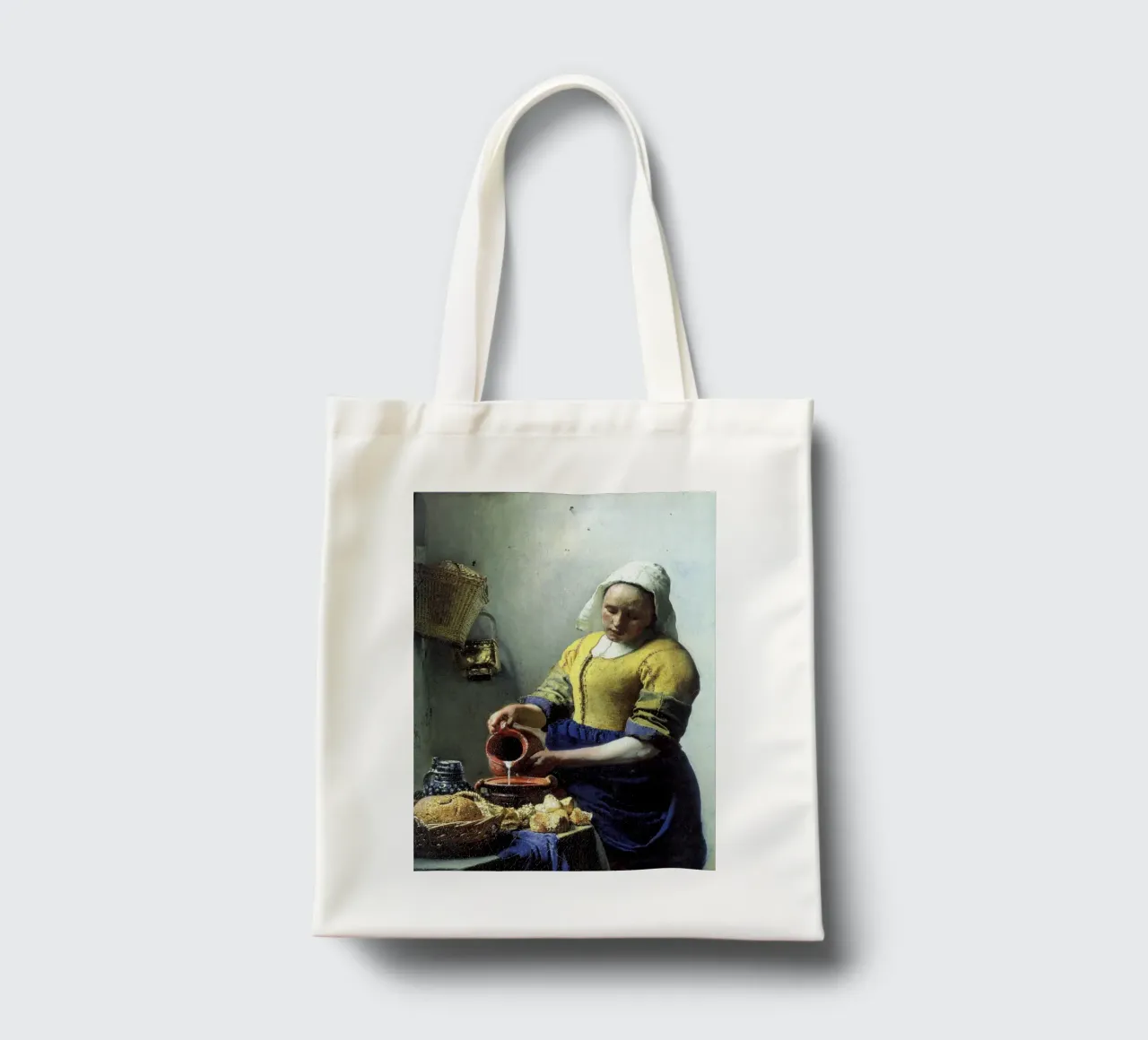 vemeer - una sguattera che versa il latte borsa in juta da The Dinda