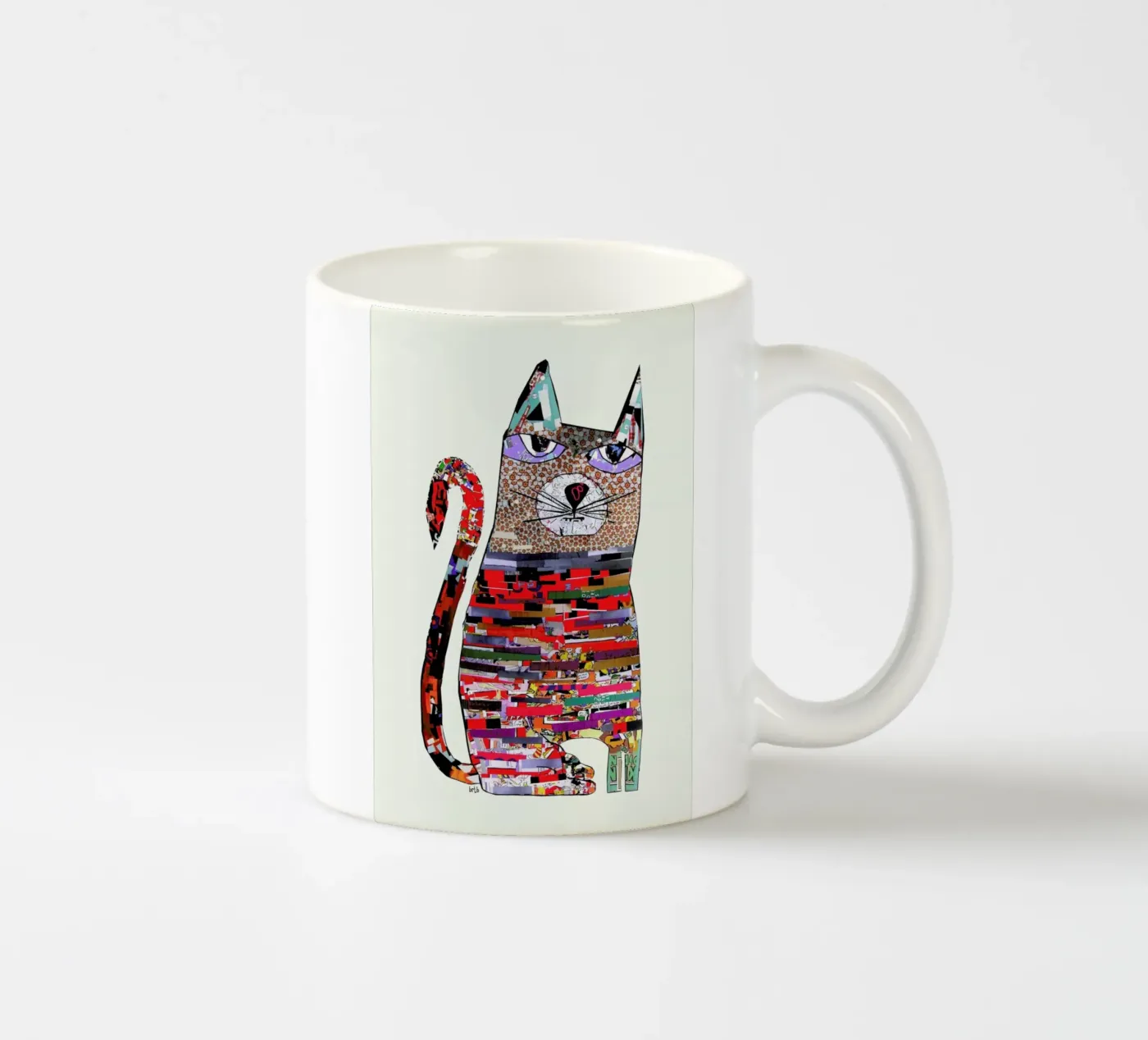 pepper cat ceramic mug by Brian Buckley