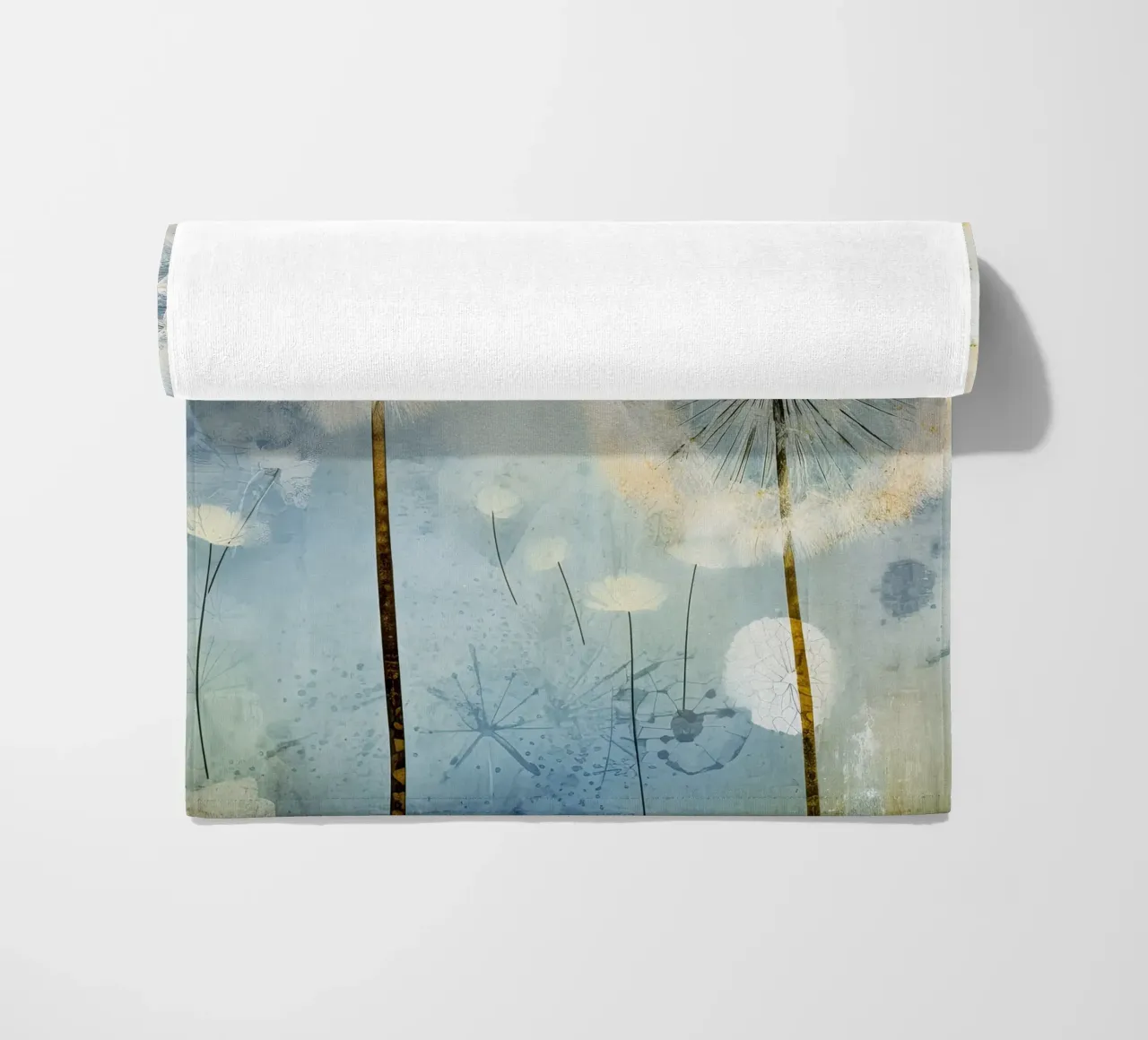 Dandelion fluff on blue background beach towel by Imagine