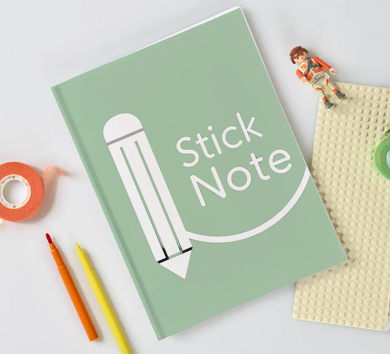 Simple and modern design featuring pencil and a sticky note notebook by DesignDoodle