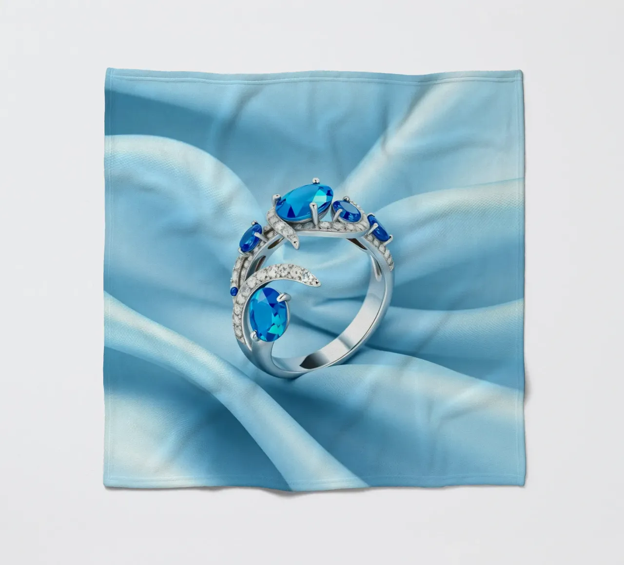 Elegante anello con gemma blu esposto in morbido tessuto di seta blu coperta in pile da DesignDoodle