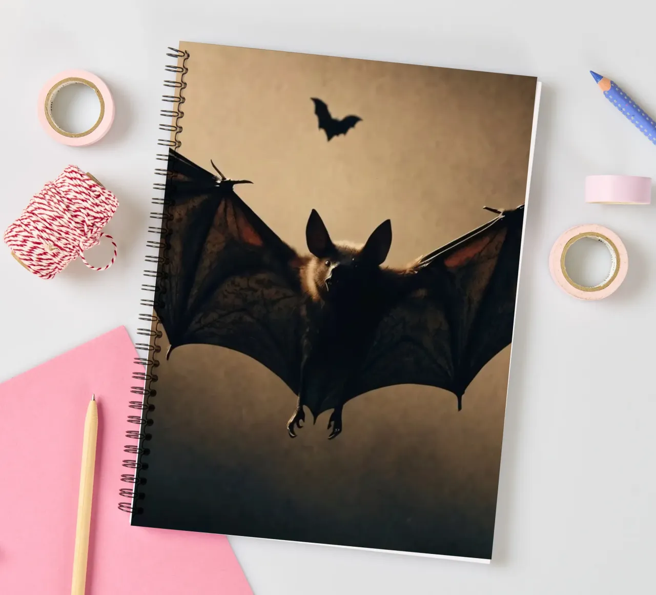 Bats flying in the twilight sky over a dark landscape during spiral notebook by DesignDoodle