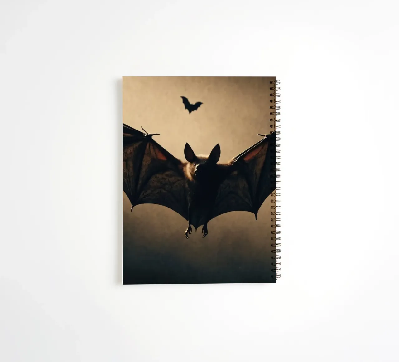 Bats flying in the twilight sky over a dark landscape during spiral notebook by DesignDoodle
