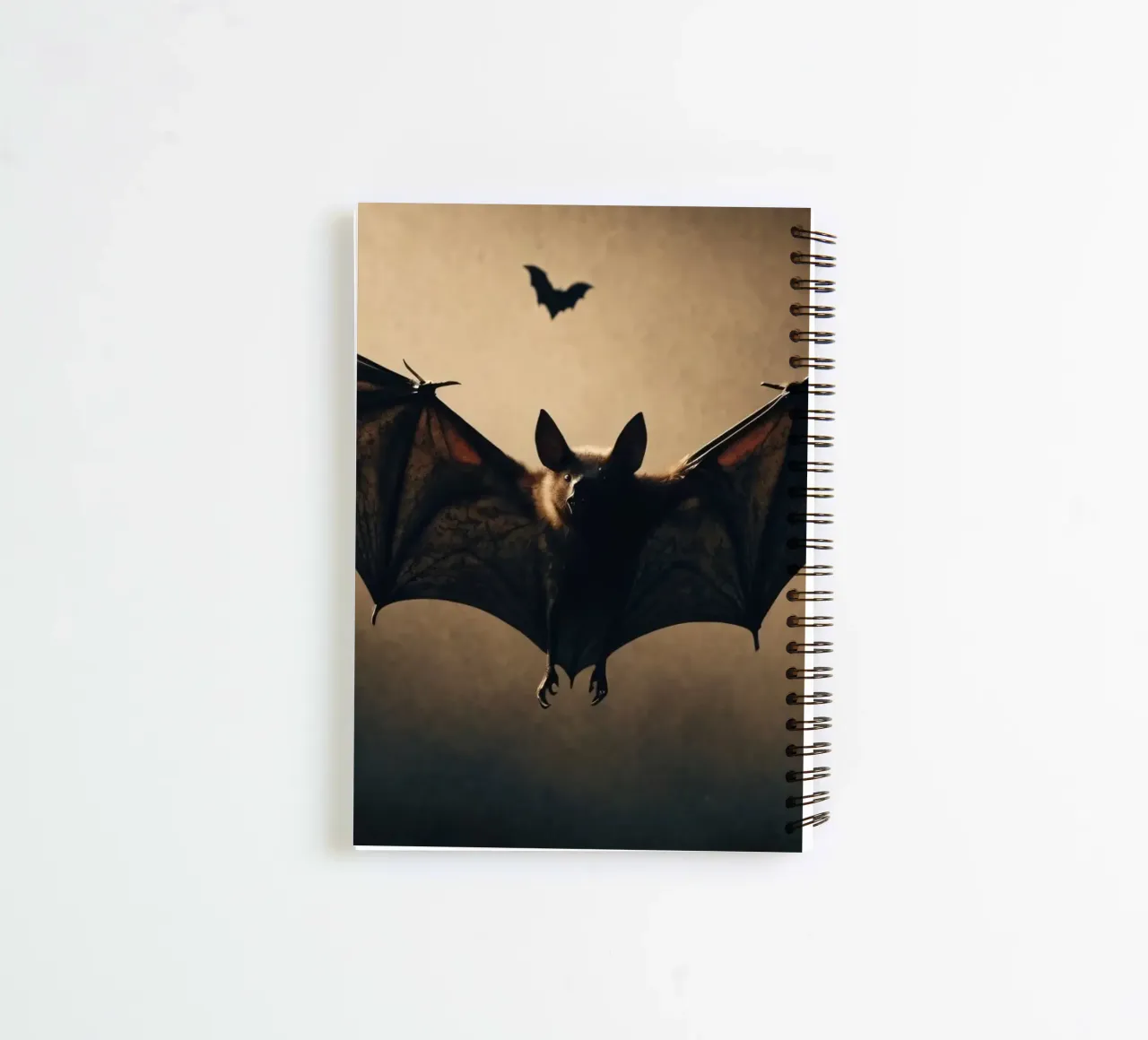 Bats flying in the twilight sky over a dark landscape during spiral notebook by DesignDoodle