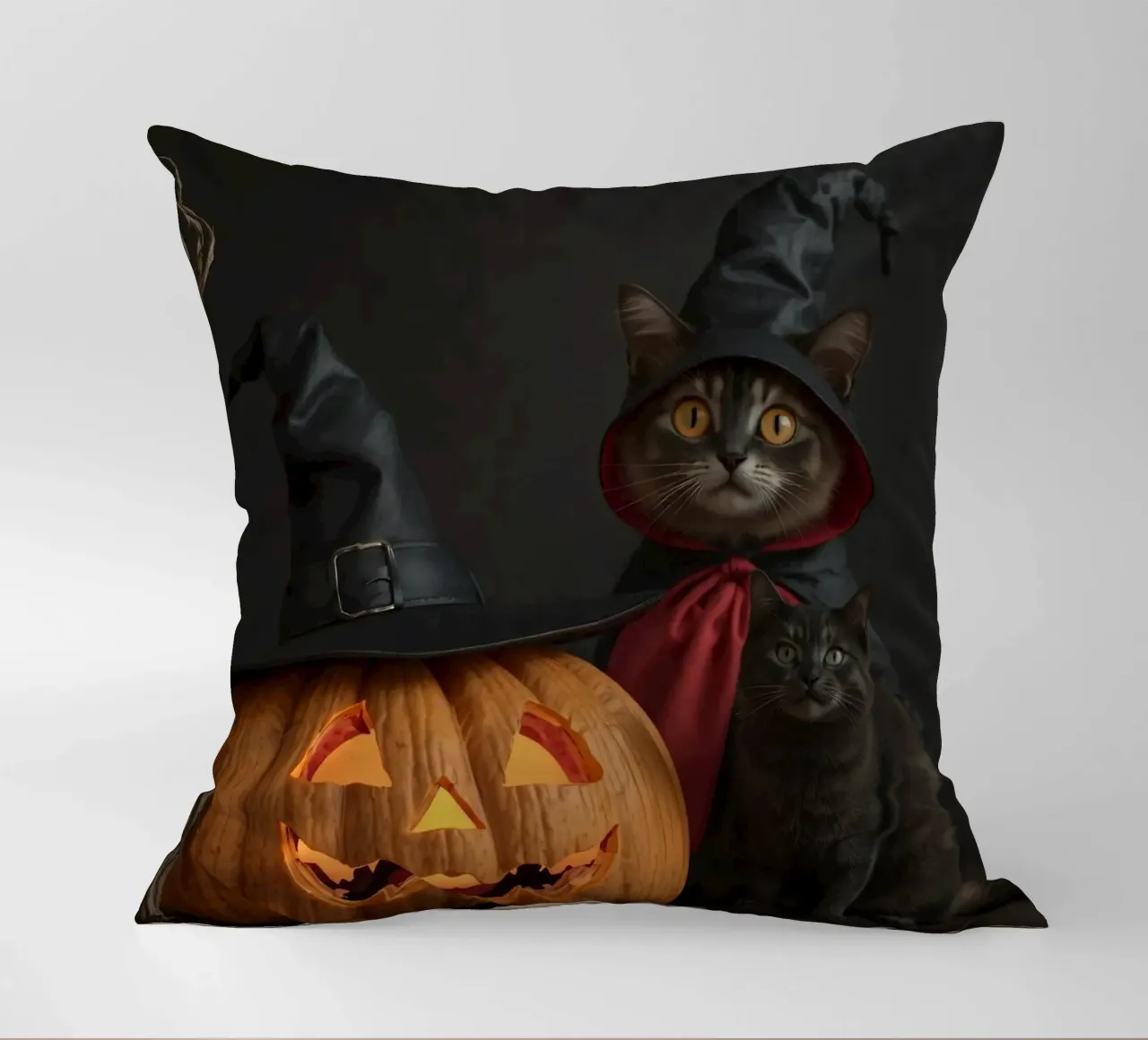 Gatti con cappelli da mago posano accanto a una zucca intagliata cuscino da DesignDoodle