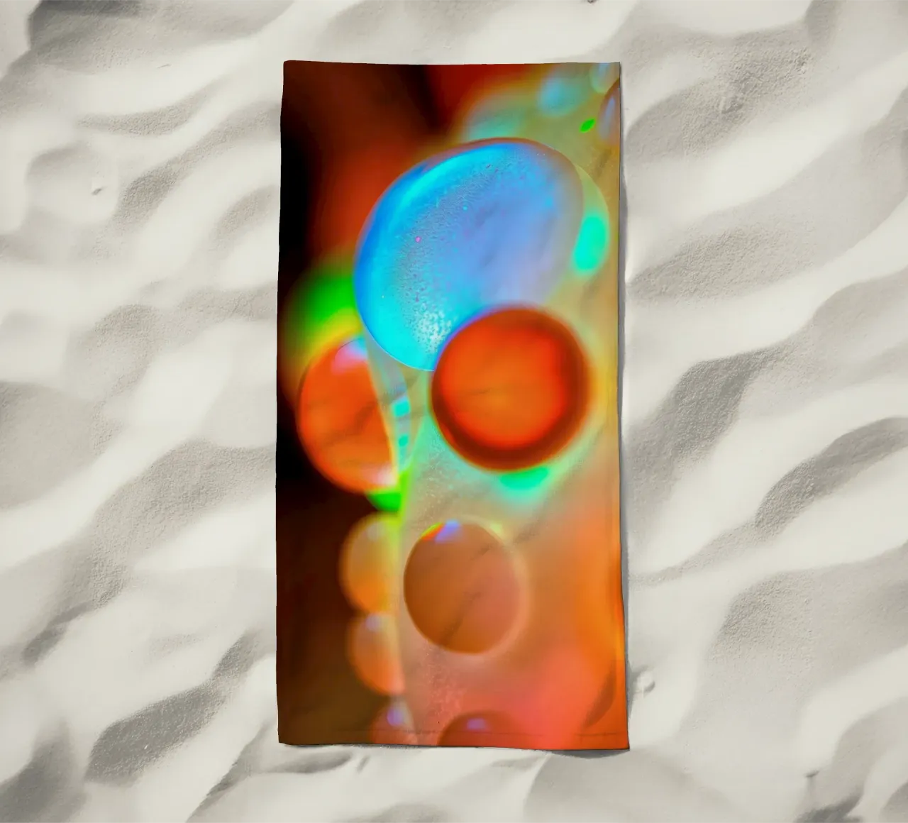 Colorful abstract design with illuminated bubbles beach towel by DesignDoodle