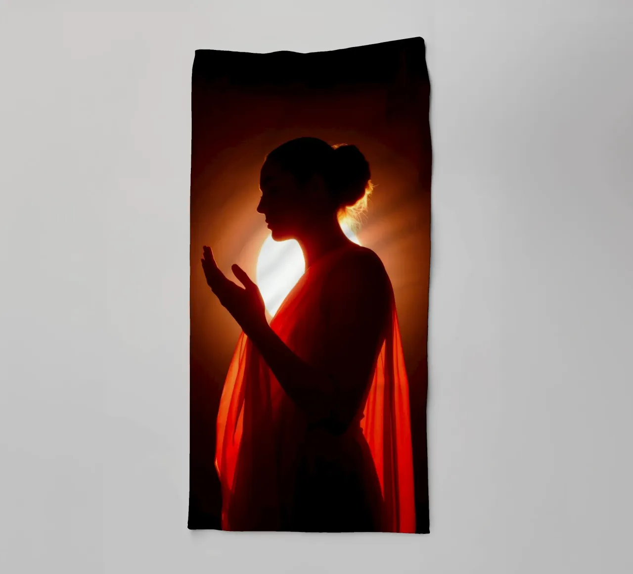 Elegant silhouette of a figure surrounded by warm glowing towel by DesignDoodle