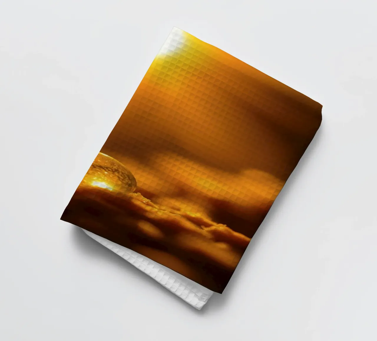 Orbe d'or transformateur reflétant la lumière sur une surface douce torchon de DesignDoodle