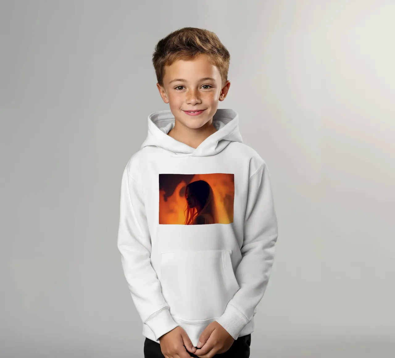 Elegant silhouette stands against a fiery background kids hoodie by DesignDoodle