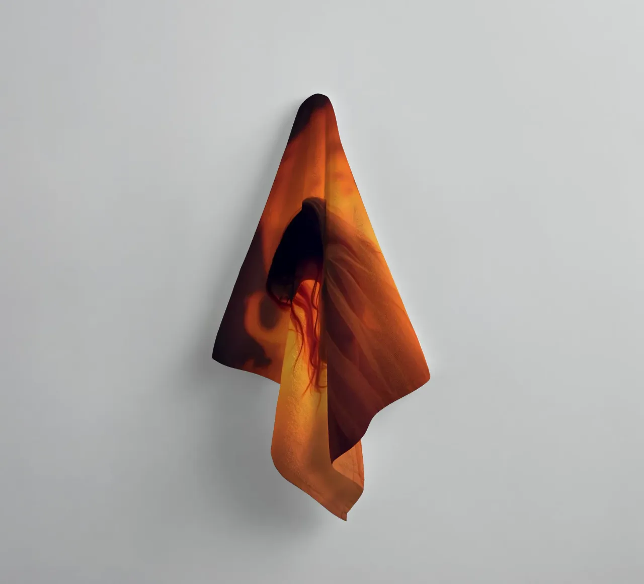 Elegant silhouette stands against a fiery background towel by DesignDoodle