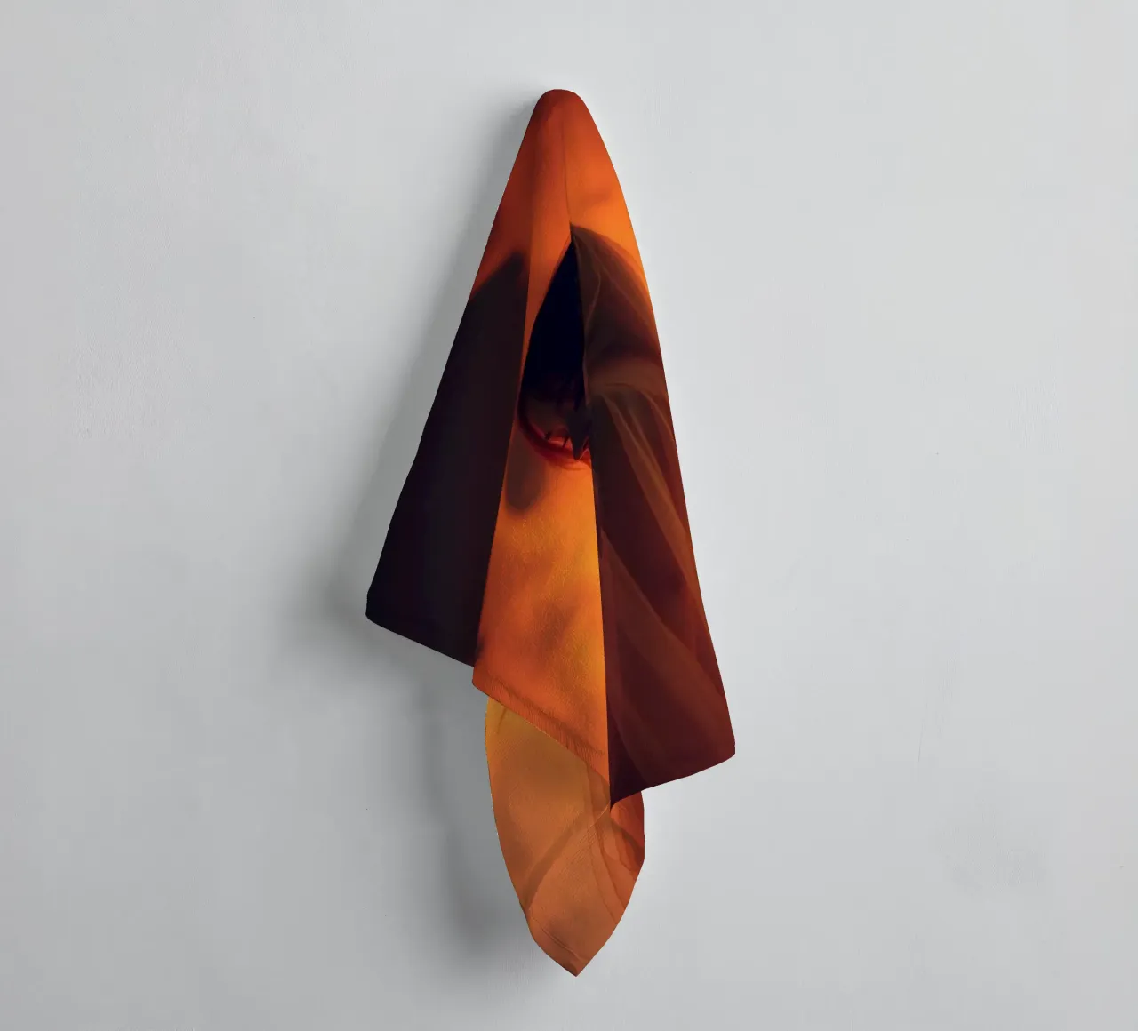 Elegant silhouette stands against a fiery background towel by DesignDoodle