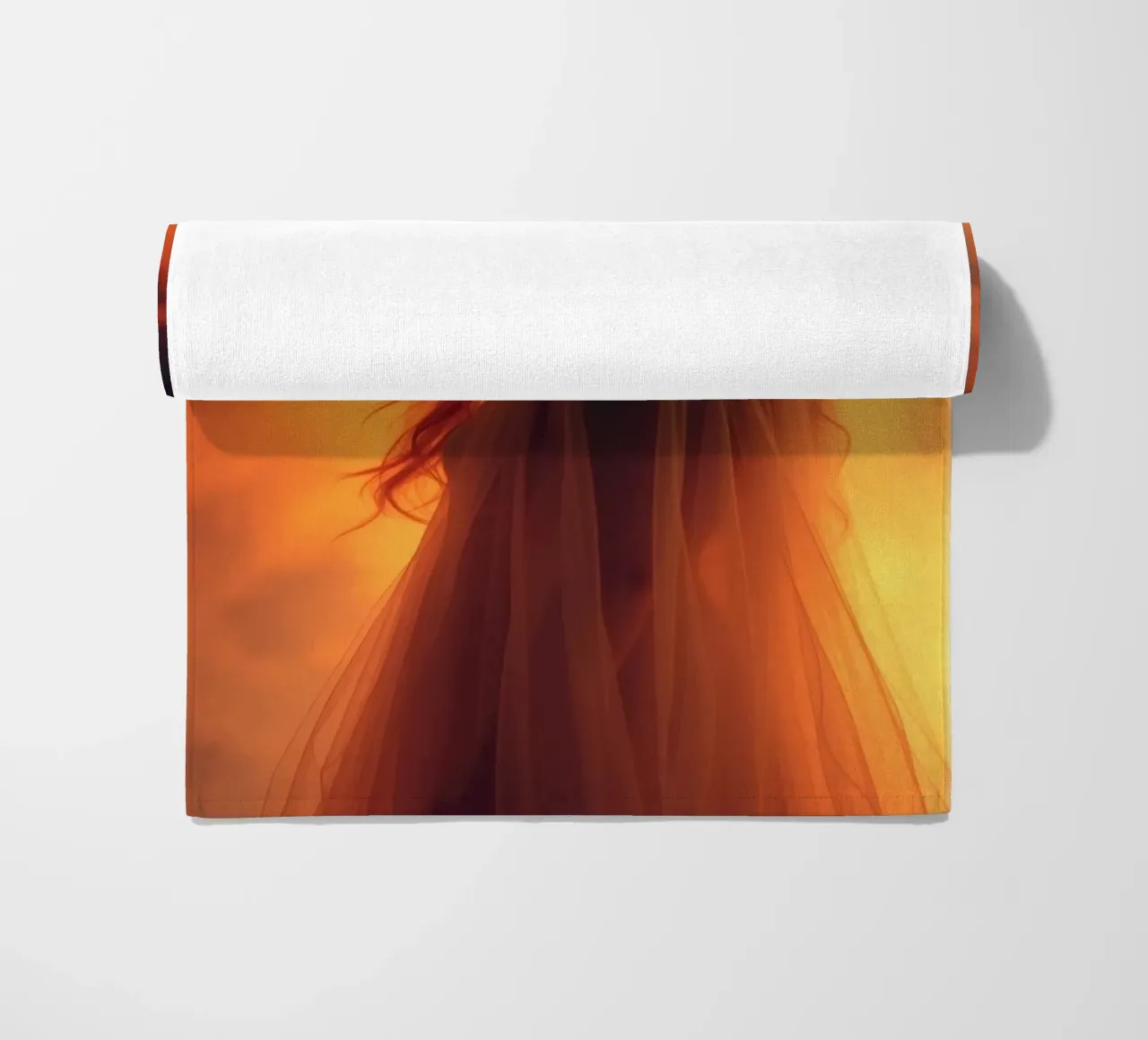 Elegant silhouette stands against a fiery background beach towel by DesignDoodle