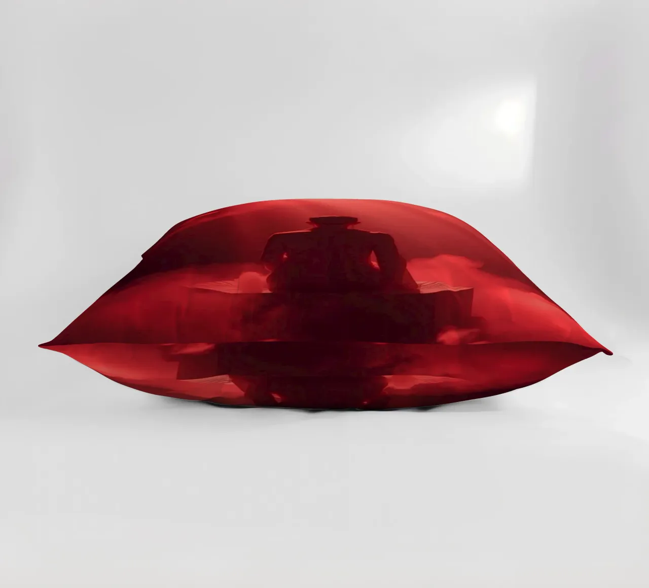 Captivating red light envelops a man sitting on a box in fog decorative cushion by DesignDoodle