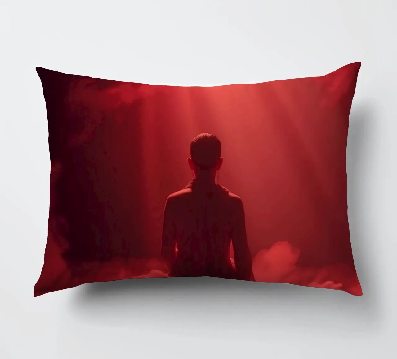 Captivating red light envelops a man sitting on a box in fog decorative cushion by DesignDoodle