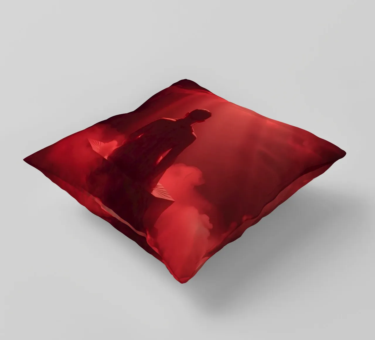 Captivating red light envelops a man sitting on a box in fog decorative cushion by DesignDoodle