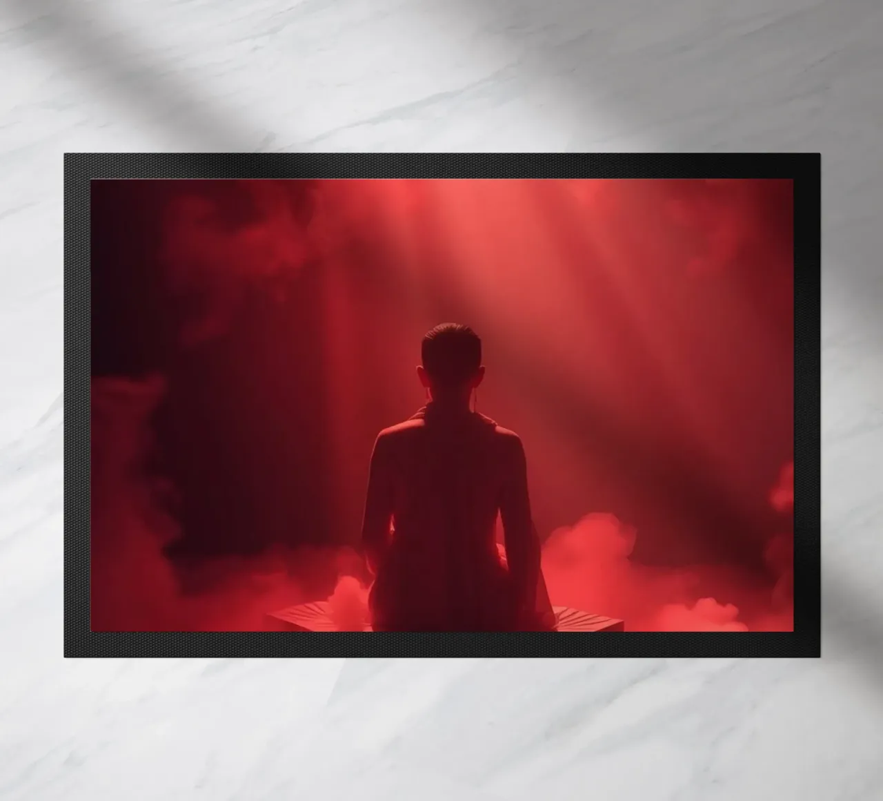 Captivating red light envelops a man sitting on a box in fog doormat by DesignDoodle