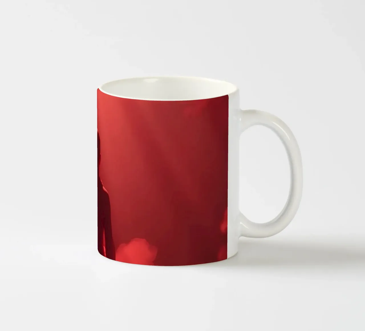 Captivating red light envelops a man sitting on a box in fog ceramic mug by DesignDoodle