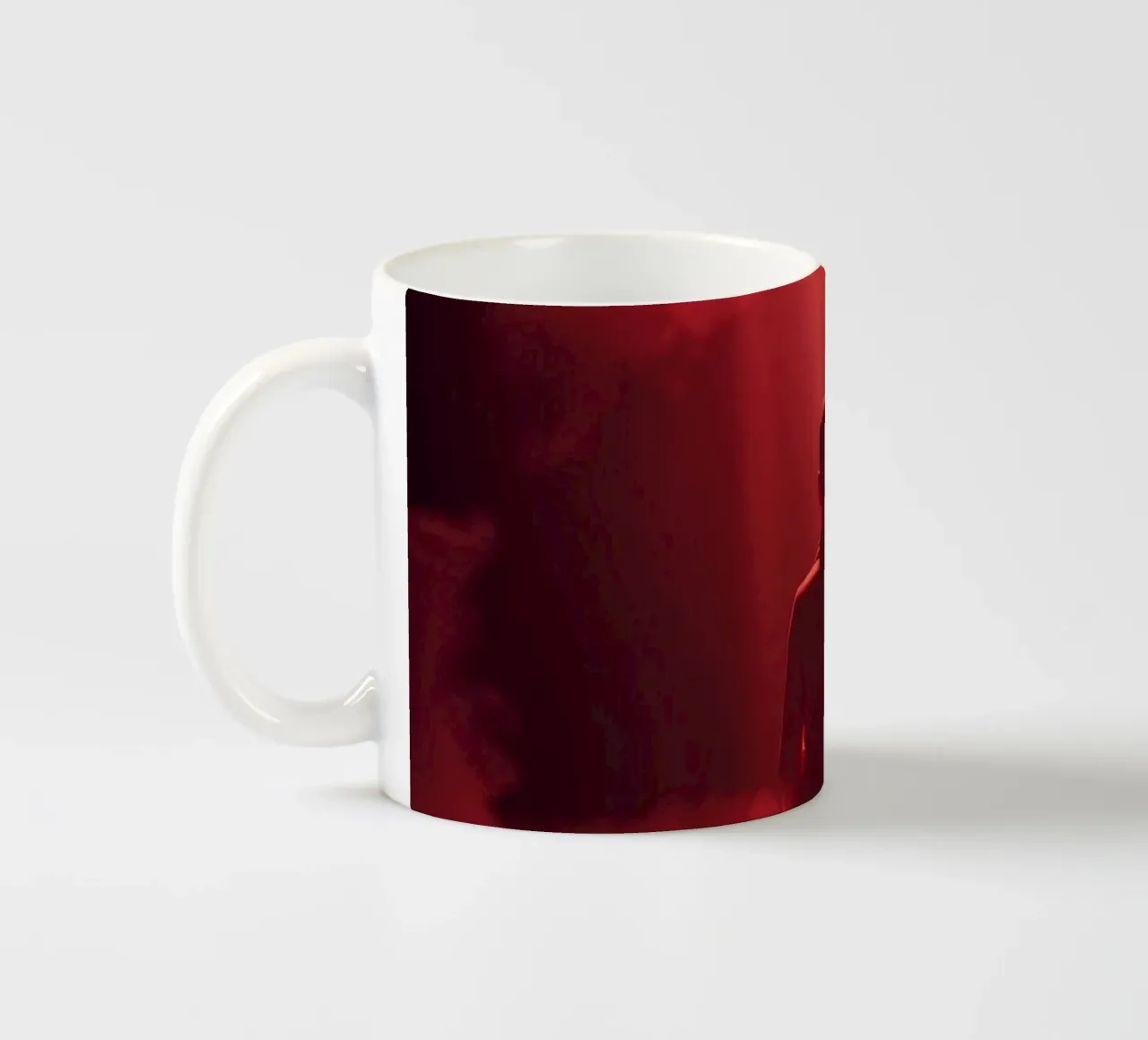 Captivating red light envelops a man sitting on a box in fog ceramic mug by DesignDoodle