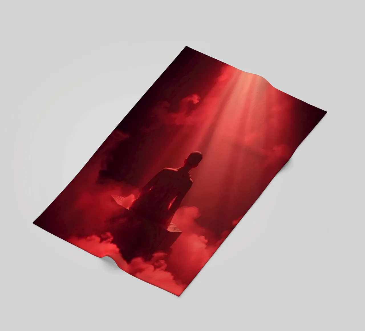 Captivating red light envelops a man sitting on a box in fog beach towel by DesignDoodle