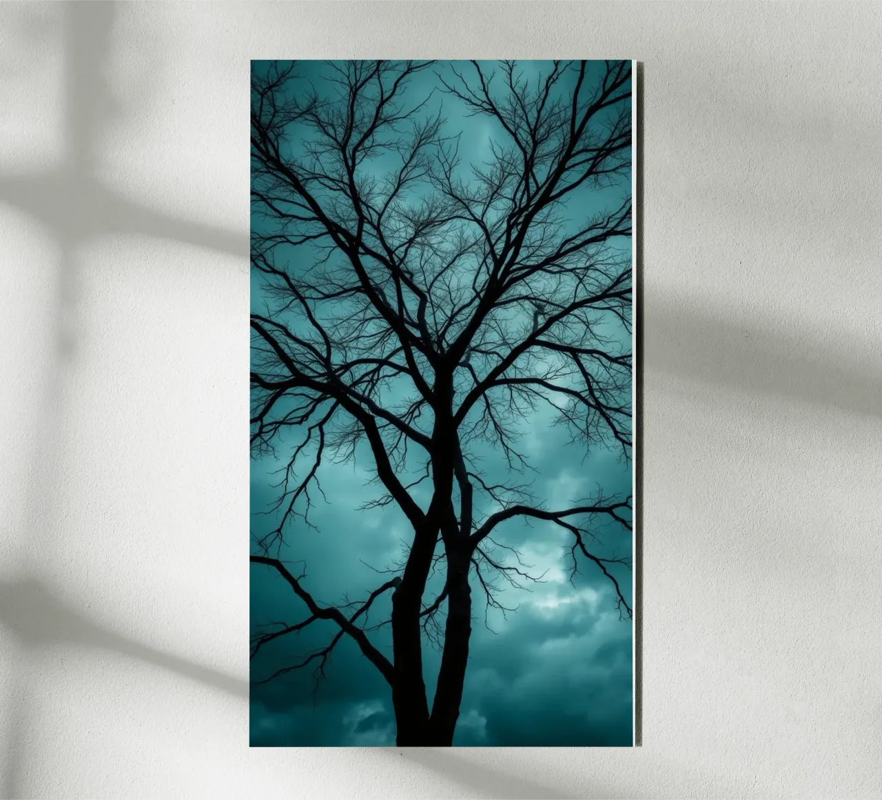 Dark silhouette of a leafless tree against a stormy sky alu-dibond by DesignDoodle