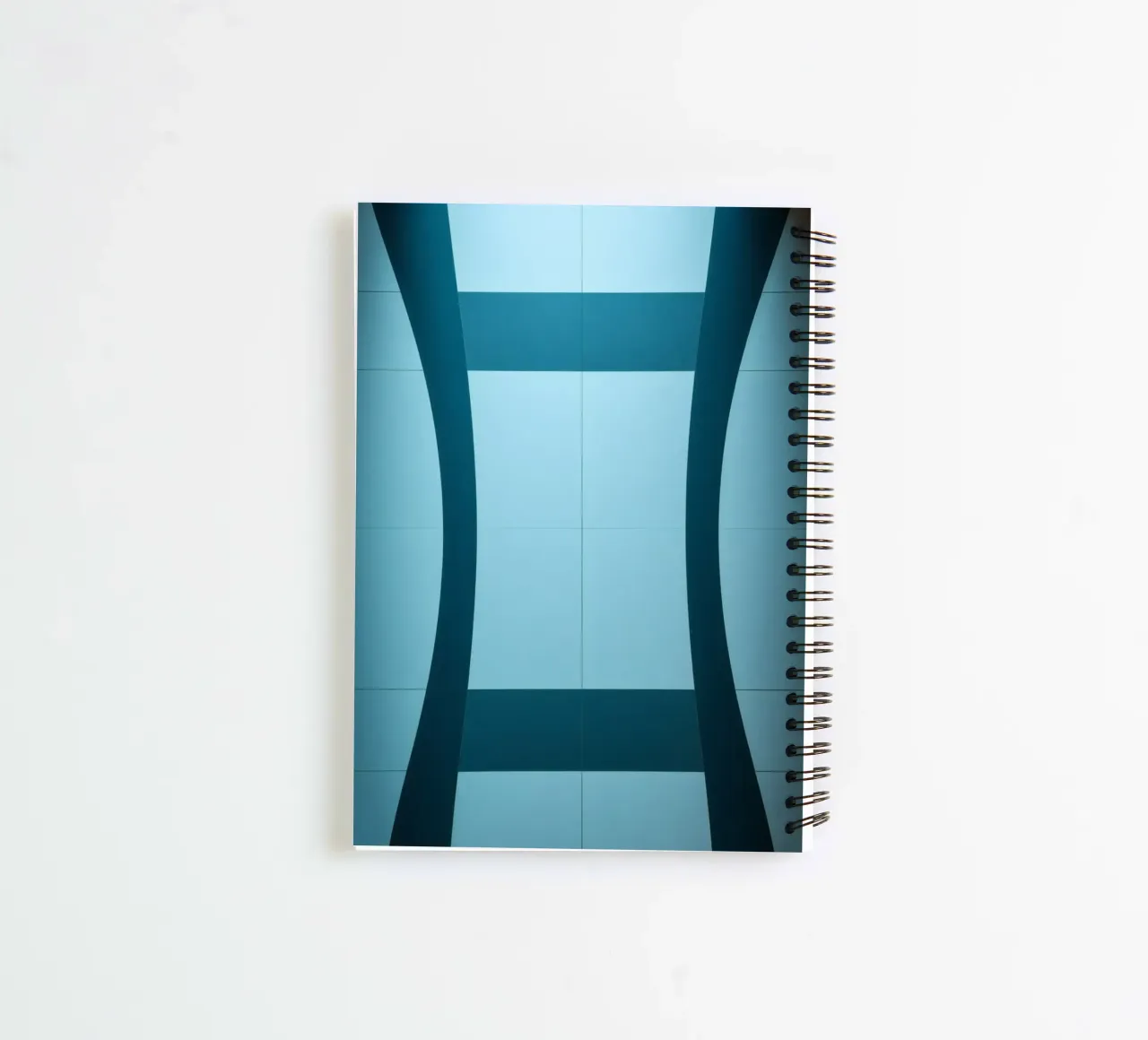 Unique abstract design with smooth curves and contrasting spiral notebook by DesignDoodle